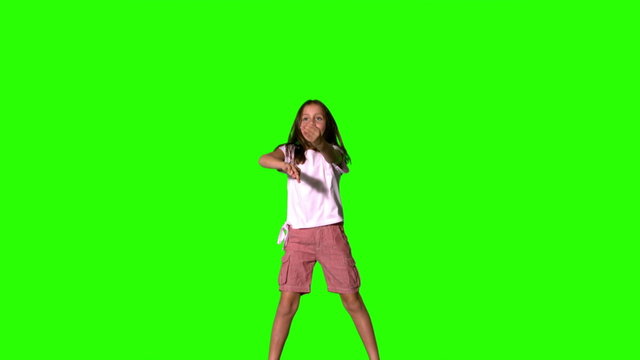 Girl jumping up and down on green screen