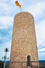 St. John Castle Tower with the catalonian flag, in Blanes, Spain