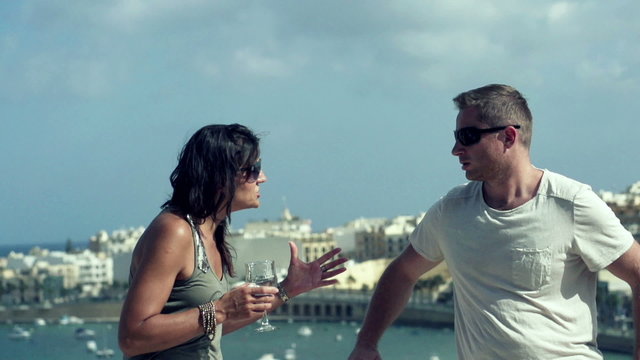 Conflicting couple-woman splashed man face, slow motion shot at 