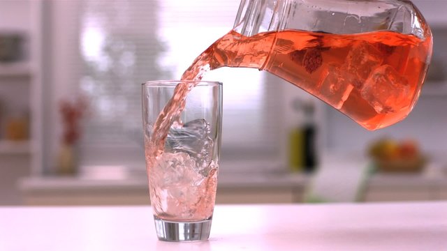 Pouring juice into a glass
