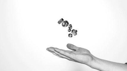 Mans hand throwing screws and bolts - Powered by Adobe