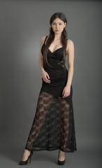 Fototapeta premium beautiful woman in elegant dress posing in studio