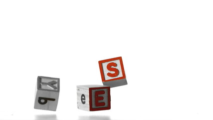 Blocks spelling yes falling over - Powered by Adobe