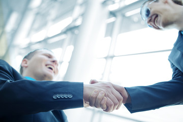 Business shaking hands with copy space (selective focus)