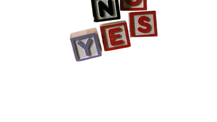 Blocks spelling yes and no falling over on white background - Powered by Adobe