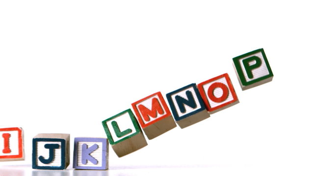 Separated alphabet blocks falling over