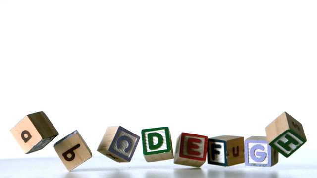 Some alphabet blocks falling over