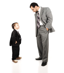 Young father and his son wearing suits