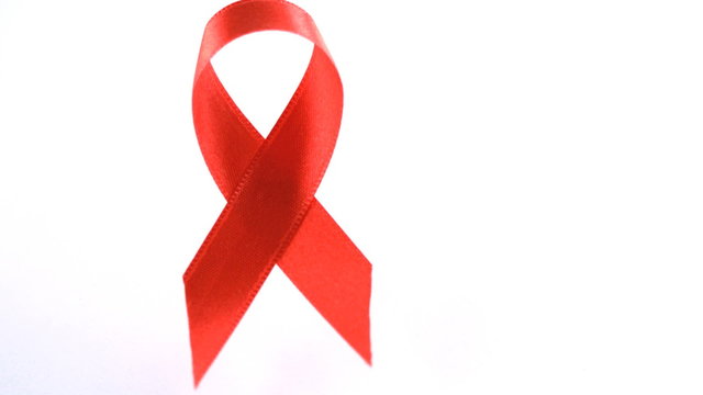 Red Aids awareness ribbon dropping down