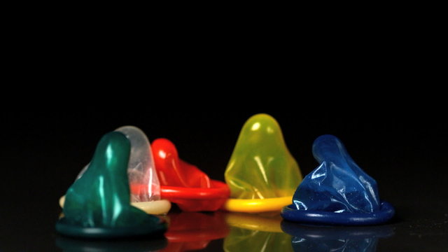 Couloured condoms falling over