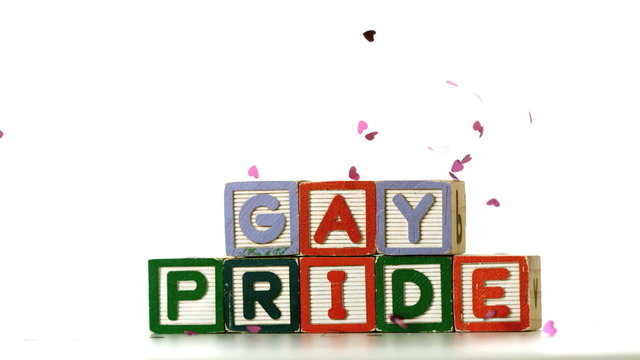 Confetti falling on blocks spelling gay pride