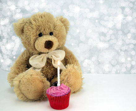 Bear with cake and candle.