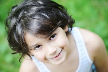 Closeup portrait of a little kid in nature