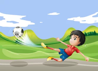 Foto op Plexiglas Een speler die op straat voetbalt © GraphicsRF