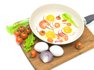 fried eggs, tomatoes and lettuce on a white background