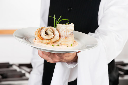 Waiter Presenting Salmon Roll