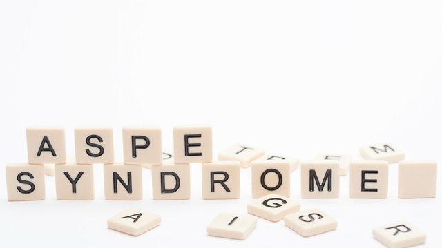 Autism and asperger spelled out in plastic letter pieces