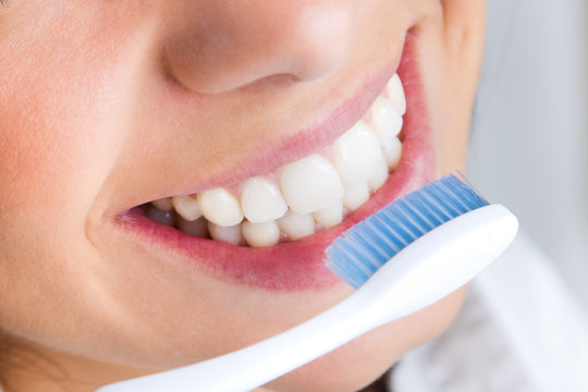 Beautiful Young Woman Picking His Teeth