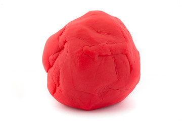 Ball of red play dough on white