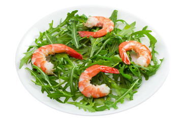 salad rucola and shrimps on the plate