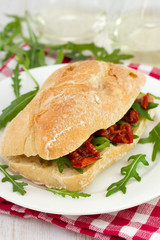 sandwich with dried tomato and rucola