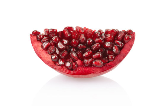 Pomegranate slice on white, clipping path included