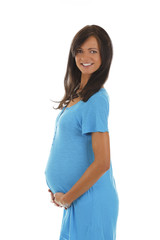 Fototapeta premium Glückliche schwangere Frau im blauen Kleid hält ihren Bauch