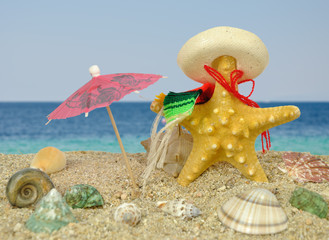 Starfish with sombrero and sun umbrella