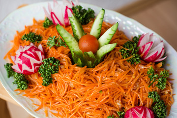 Carrot salad decorated with  vegetables