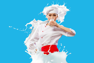 Asian female cook against milk splashes - Powered by Adobe