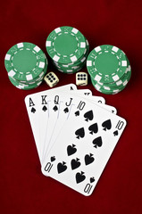 Playing cards (Royal flush), casino chips and dices