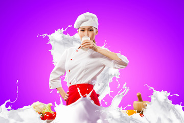 Asian female cook against milk splashes