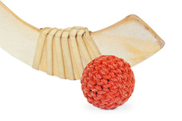 Hockey stick and wicker ball