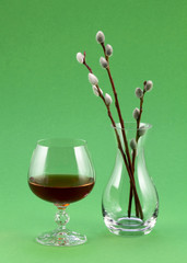 Glass of wine and a transparent vase