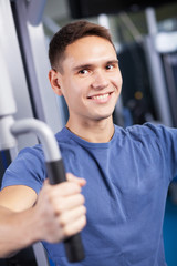 Fototapeta na wymiar Portrait of a trainer in a fitness center
