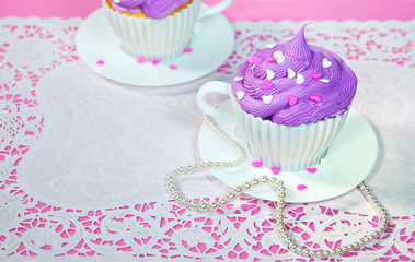 cake in a teacup with pearls