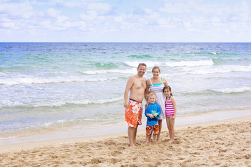 Beautiful Family enjoying a day at the beach