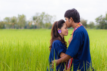 Couple Thai farmer on rice fields