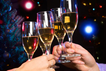  People hands with crystal glasses full of champagne