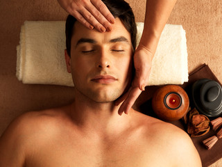 Man having head massage in the spa salon