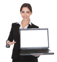 Smiling Businesswoman Holding Laptop