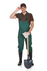 Happy young gardener in dungarees