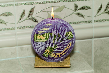 Candle with lavender flowers. Aromatherapy concept