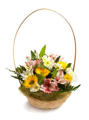 Basket with spring flowers isolated