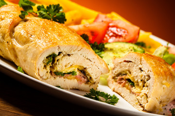 Fried wrapped meat, French fries and vegetables