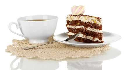 A cup of tea and delicious cake isolated on white