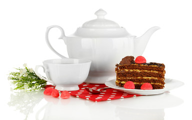 Teapot, cup of tea and delicious cake isolated on white