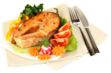 Appetizing grilled salmon with lemon and vegetables isolated