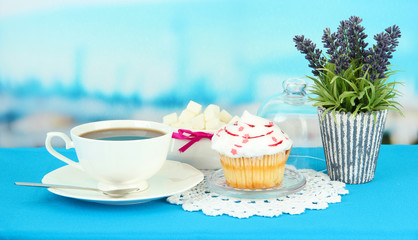 Cupcake on saucer with glass cover, on bright background