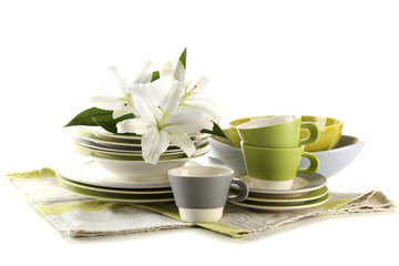 Empty bowls, plates and cups isolated on white